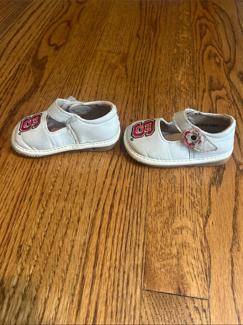 Team Squeaks Kids White Mary Jane Shoes with Red NC State Logo